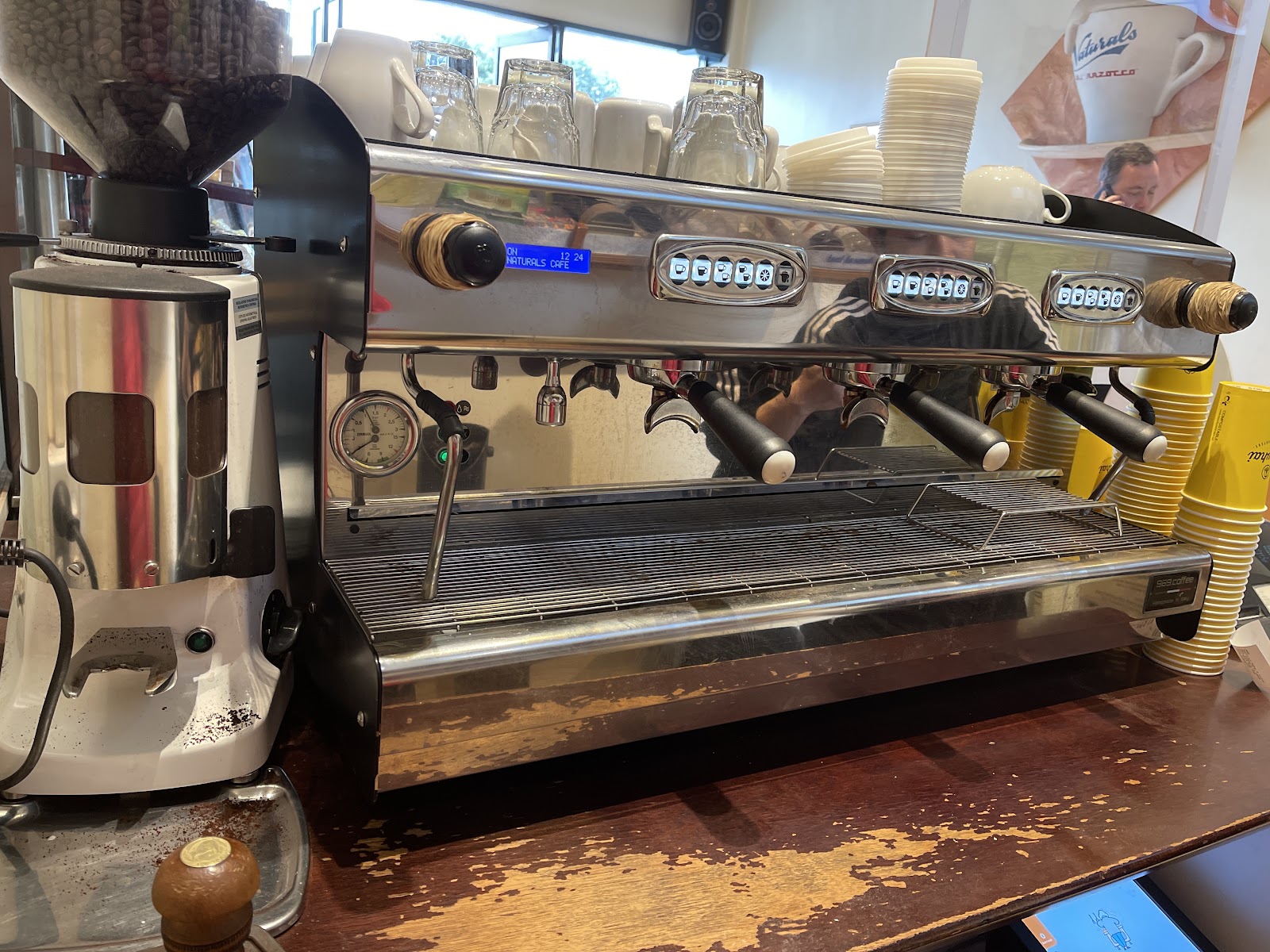 Coffee machine and cups inside the bakery